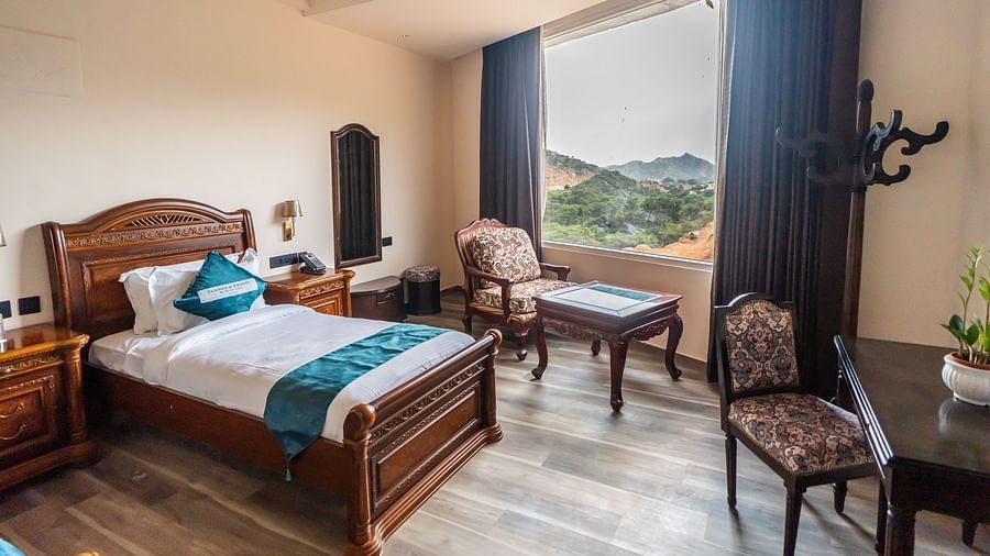 an image of a bedroom with mountain views